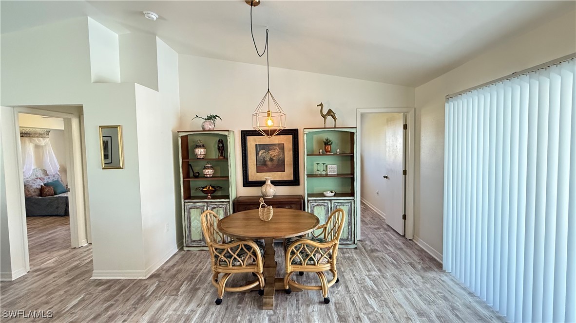 18161 Interlochen Lane Alva, FL 33920 - Photo 6 of 25 a view of a dining room with furniture window and wooden floor