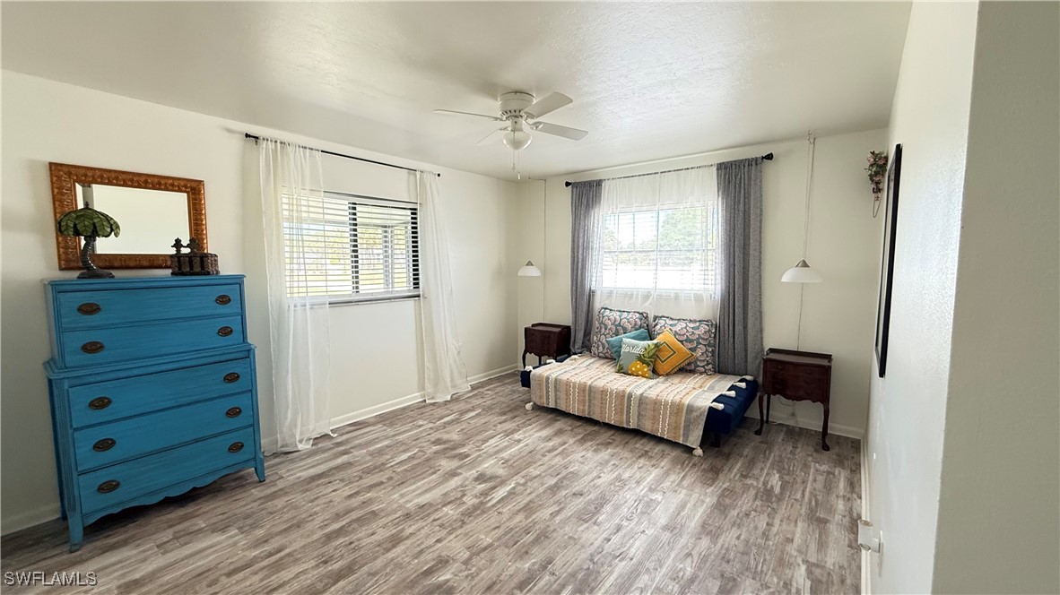 18161 Interlochen Lane Alva, FL 33920 - Photo 8 of 25 a bedroom with a bed and wooden floor