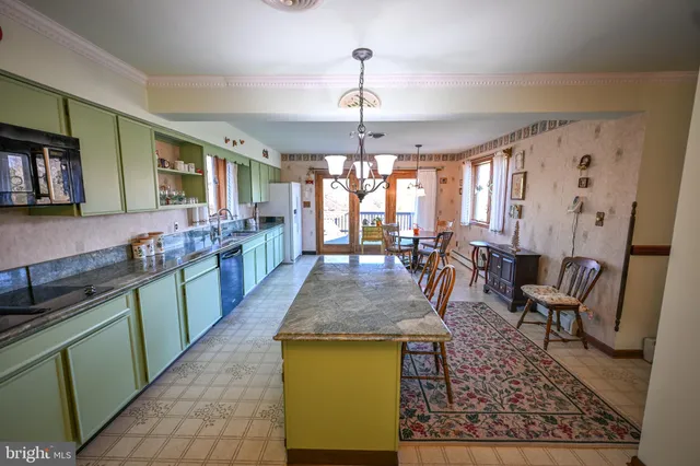 a view of a kitchen and dining area