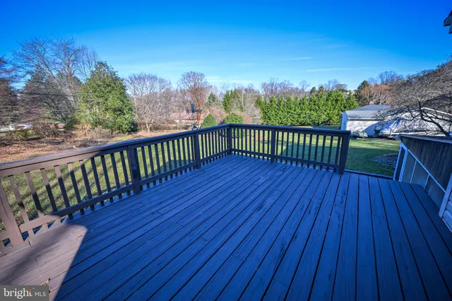 a view of a balcony with wooden floor