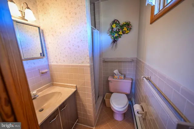 a bathroom with a sink and toilet