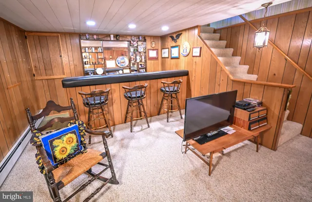a view of a patio with a table and chairs