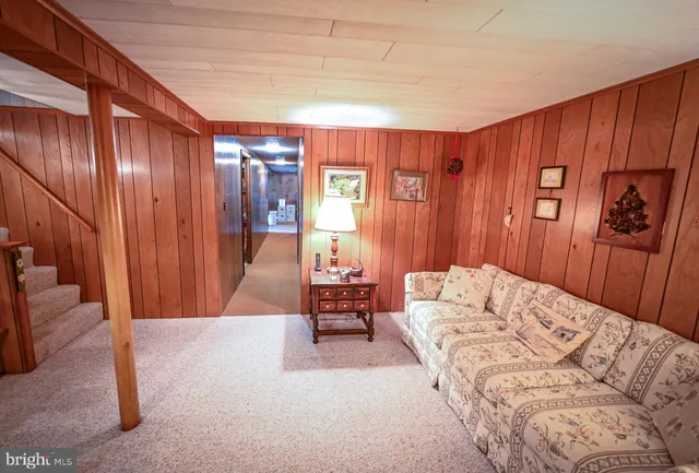 a bedroom with furniture and window