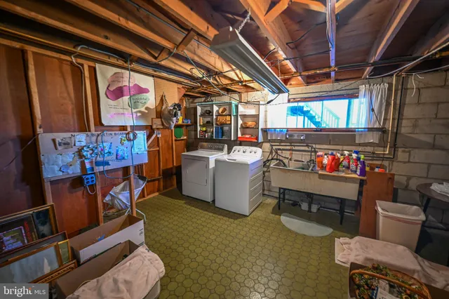 a view of a livingroom with furniture and staircase