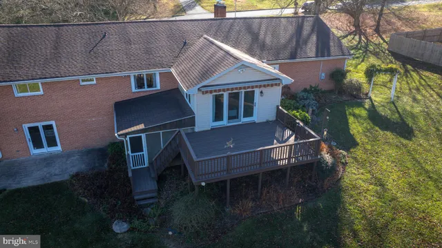 a aerial view of a house with pool and sitting space