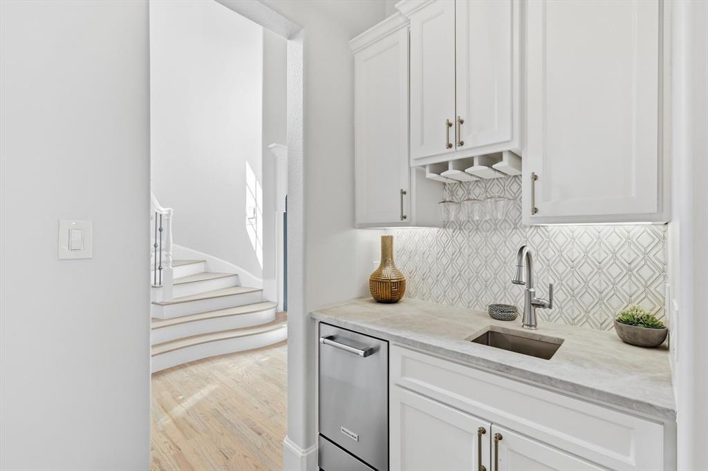 476 Hidden Valley Lane Coppell, TX 75019 - Photo 11 of 40 a kitchen with a sink and cabinets