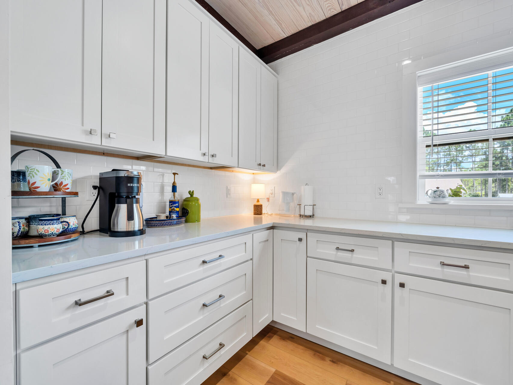 95 Roberts Road Santa Rosa Beach, FL 32459 - Photo 12 of 60 a kitchen with white cabinets and white appliances