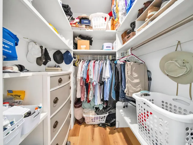 a bed room with a bed and a large window