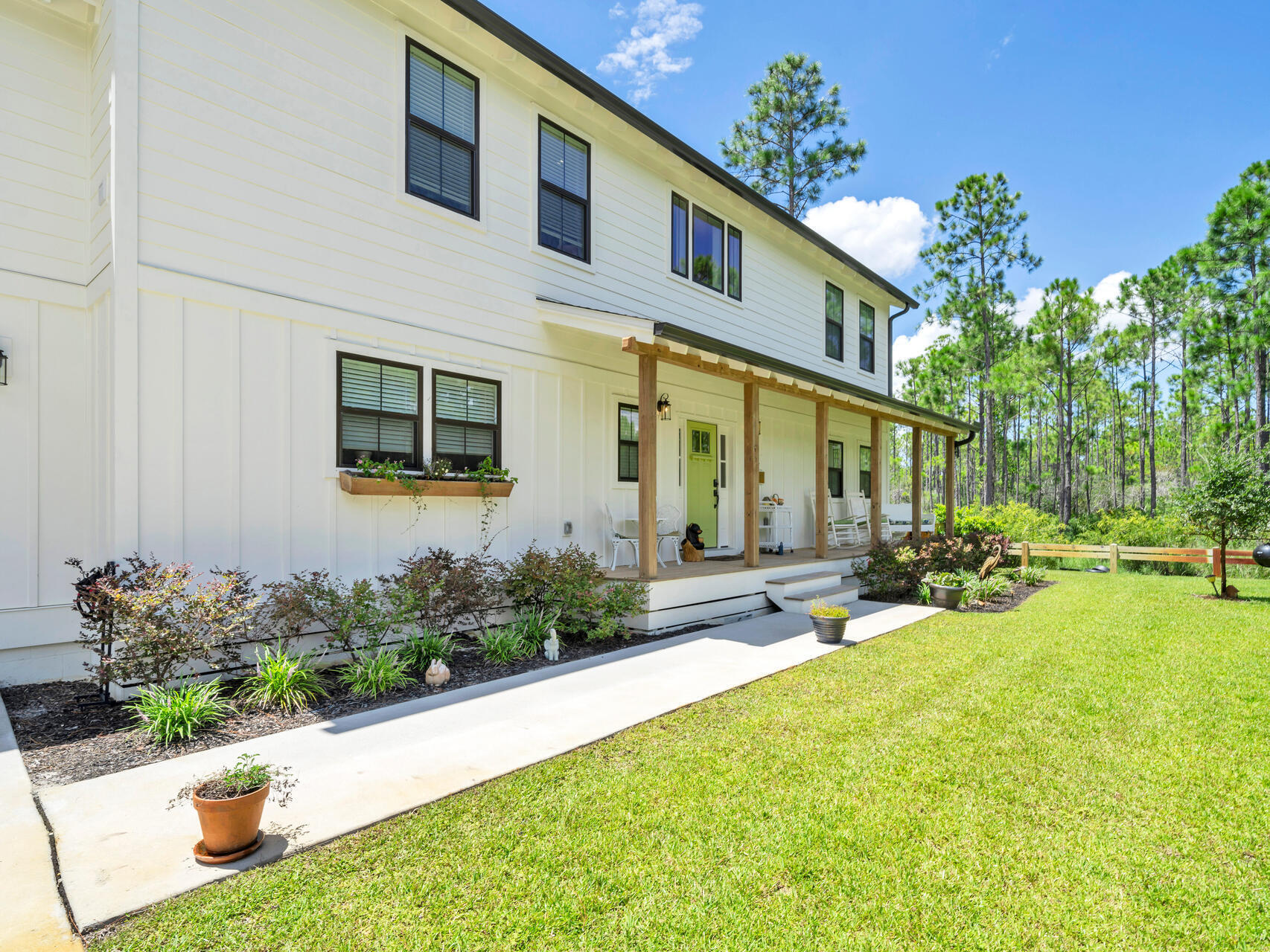 95 Roberts Road Santa Rosa Beach, FL 32459 - Photo 3 of 60 a view of a house with backyard porch and sitting area