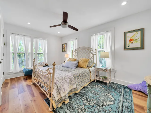 a bedroom with furniture and a chandelier