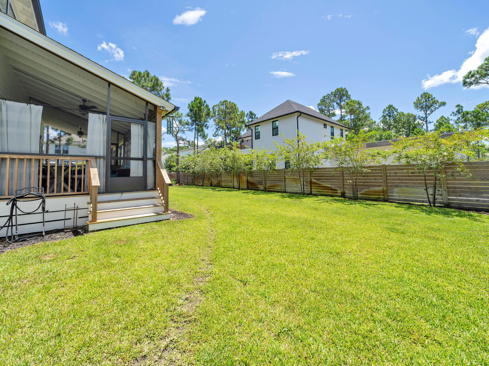 95 Roberts Road Santa Rosa Beach, FL 32459 - Photo 57 of 60 a view of a house with a yard and fence