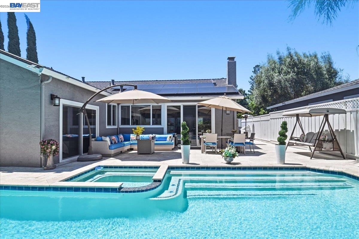 2861 Millbridge Place San Ramon, CA 94583 - Photo 46 of 58 a view of a house with backyard patio and swimming pool
