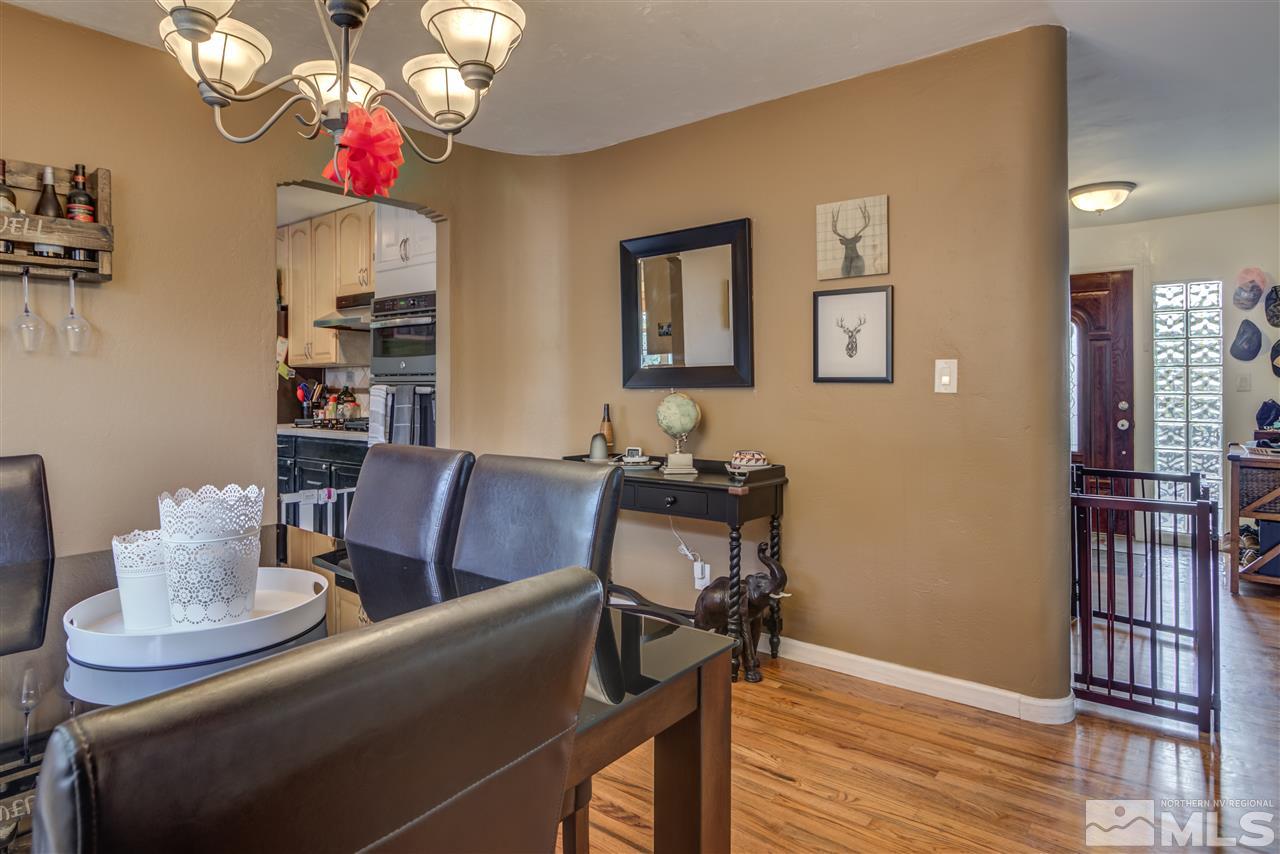 730 Barry M Circle Reno, NV 89503 - Photo 8 of 25 a view of a dining room with furniture and wooden floor