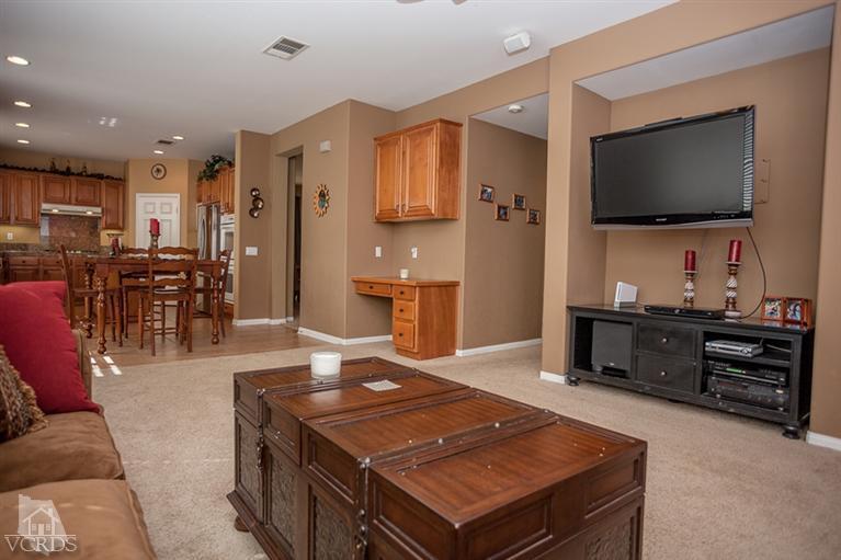 14396 Peach Hill Road Moorpark, CA 93021 - Photo 11 of 45 a living room with furniture and a flat screen tv