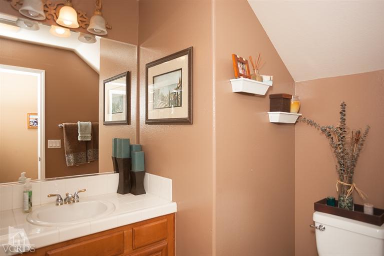 14396 Peach Hill Road Moorpark, CA 93021 - Photo 19 of 45 a bathroom with a sink and a mirror