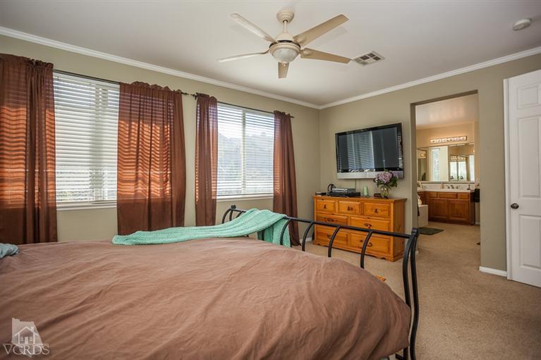14396 Peach Hill Road Moorpark, CA 93021 - Photo 25 of 45 a bedroom with a bed window and flat screen tv