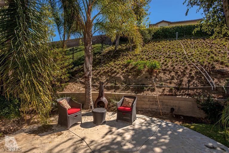 14396 Peach Hill Road Moorpark, CA 93021 - Photo 38 of 45 a view of a patio with table and chairs and potted plants
