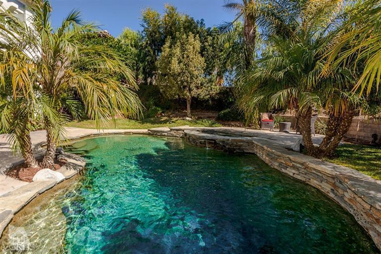 14396 Peach Hill Road Moorpark, CA 93021 - Photo 43 of 45 a backyard of a house with trees and outdoor seating