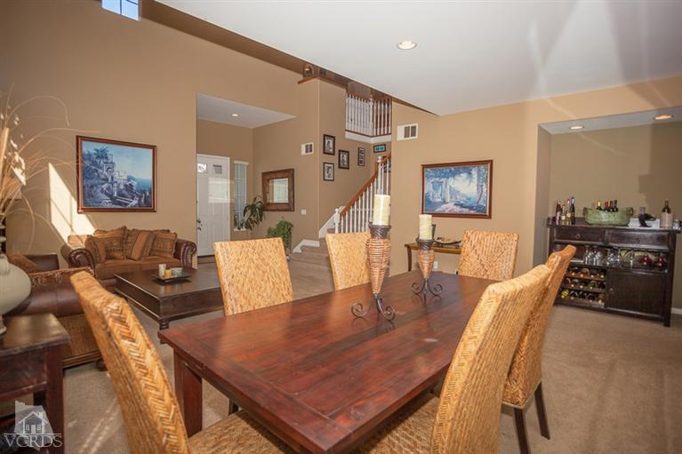 14396 Peach Hill Road Moorpark, CA 93021 - Photo 7 of 45 a view of a dining room with furniture and wooden floor