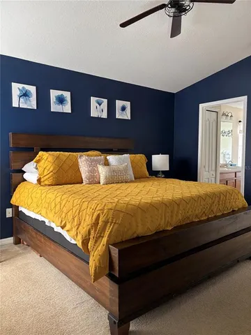 a bedroom with a bed and dresser