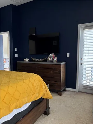 a bed sitting in a room next to a window