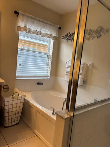 a bathroom with a bathtub and shower