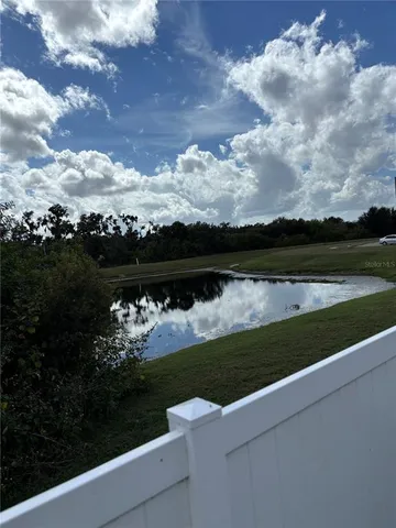 a view of a lake with a big yard