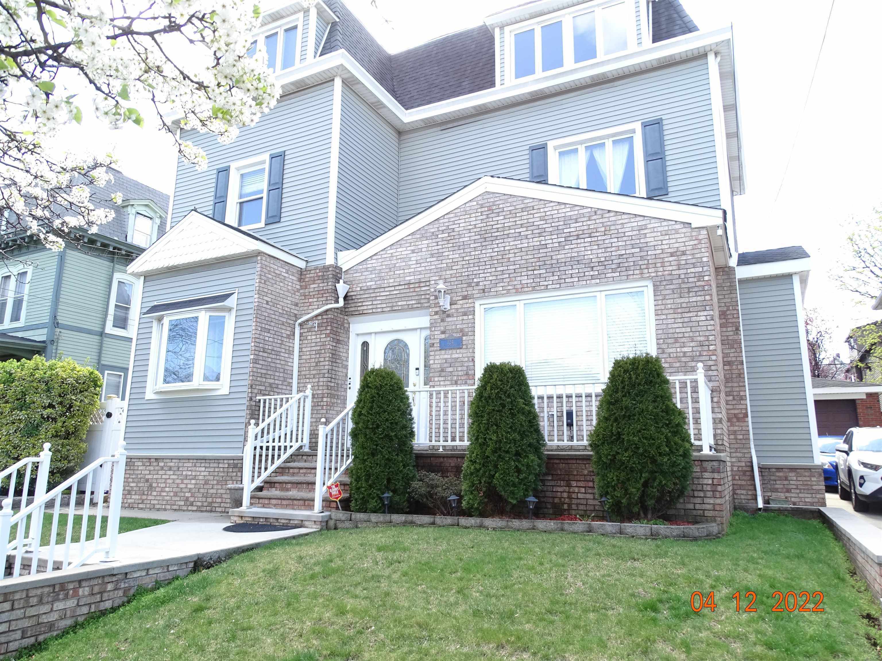 124 West 8th Street, Unit 2 Bayonne, NJ 07002 - Photo 1 of 19 a view of house with front yard