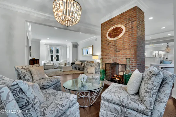 a large kitchen with stainless steel appliances lots of counter space and wooden floor