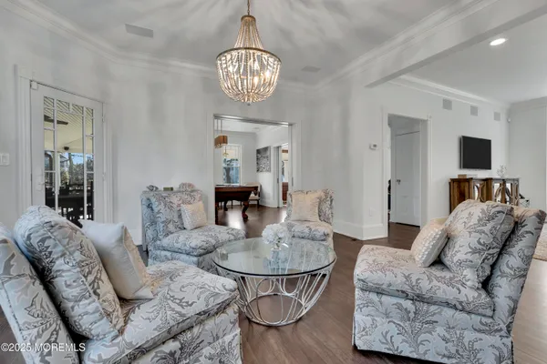 a kitchen with a stove a sink a dining table and chairs
