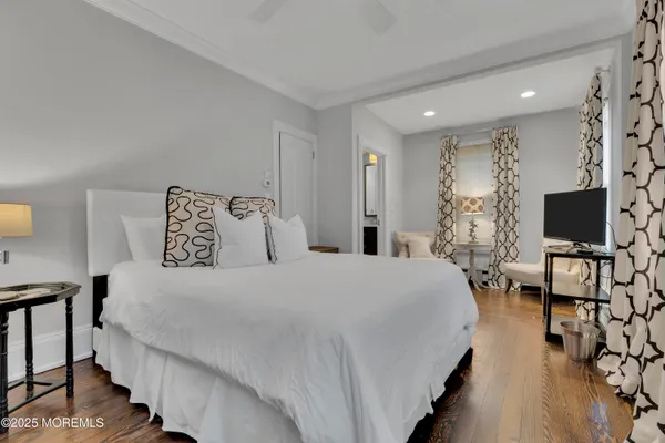 an aerial view of a house with a garden and lake view