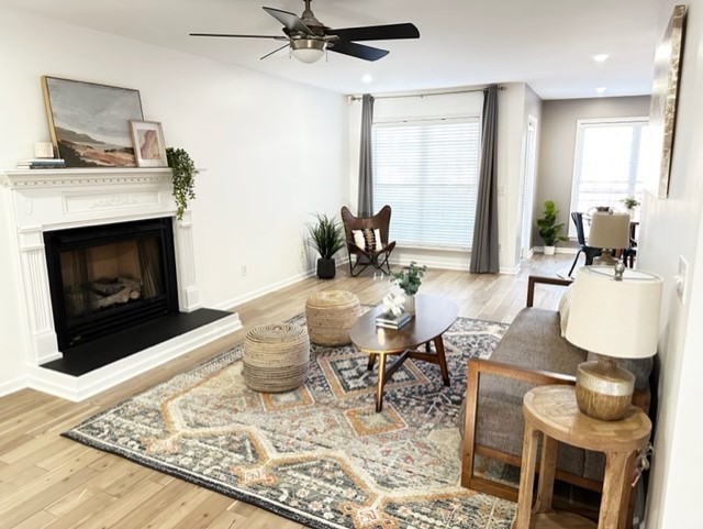 400 Roma Court Nashville, TN 37211 - Photo 17 of 31 a living room with furniture a fireplace and a table