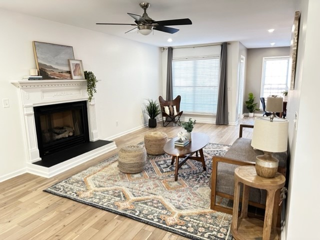 400 Roma Court Nashville, TN 37211 - Photo 20 of 31 a living room with furniture and a fireplace