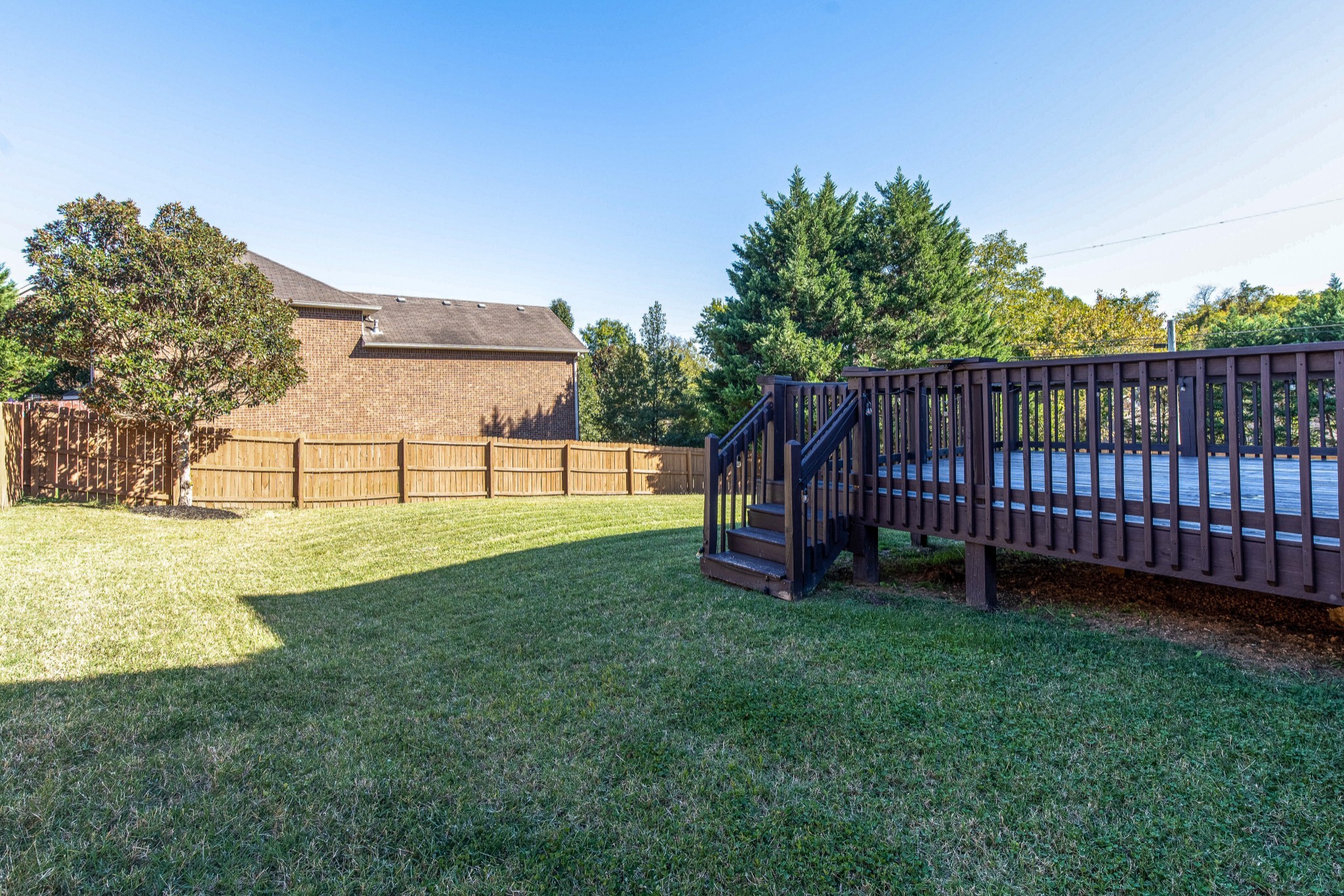 400 Roma Court Nashville, TN 37211 - Photo 29 of 31 a view of a backyard with a garden and deck