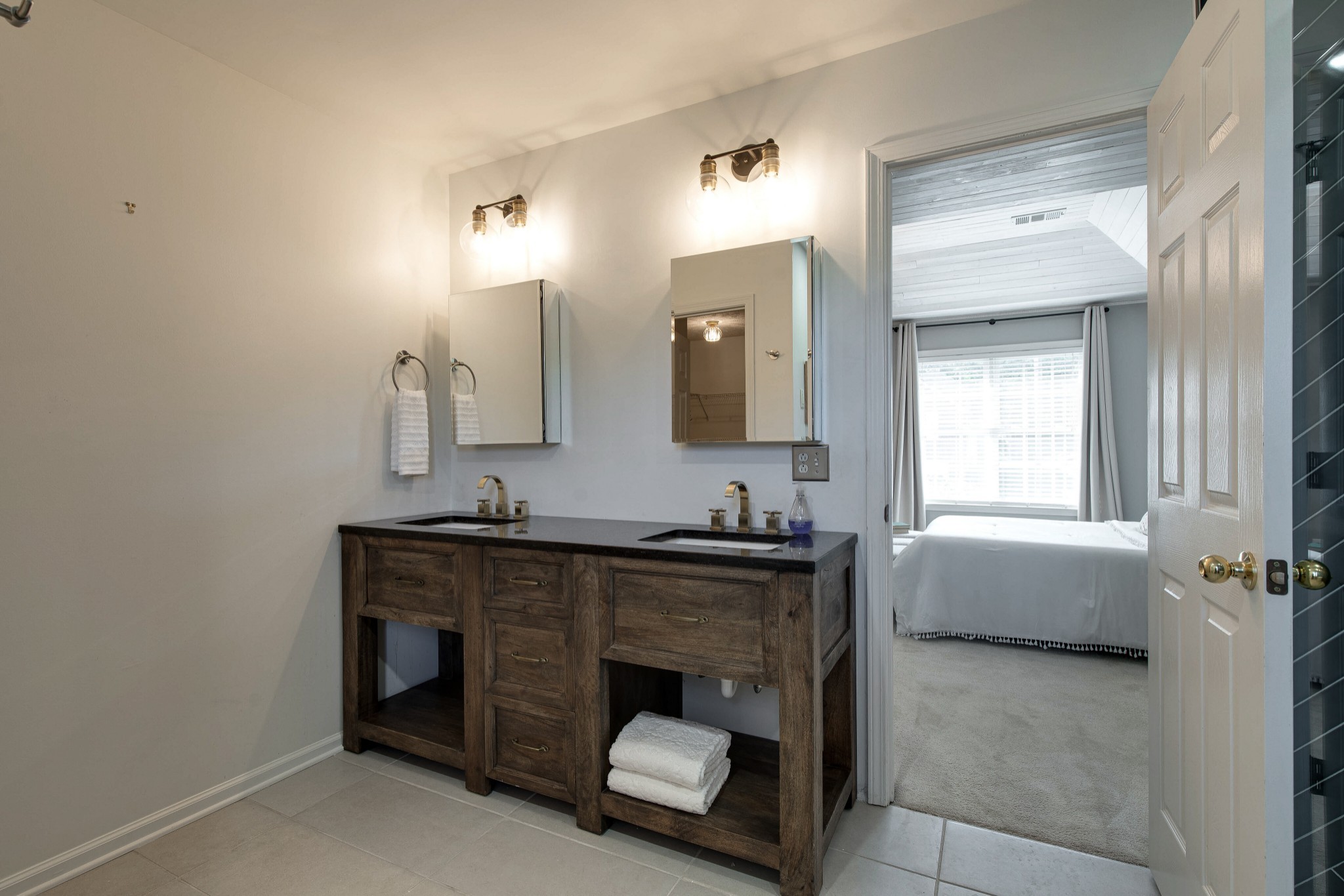 400 Roma Court Nashville, TN 37211 - Photo 7 of 31 a bathroom with a granite countertop sink a toilet and mirror
