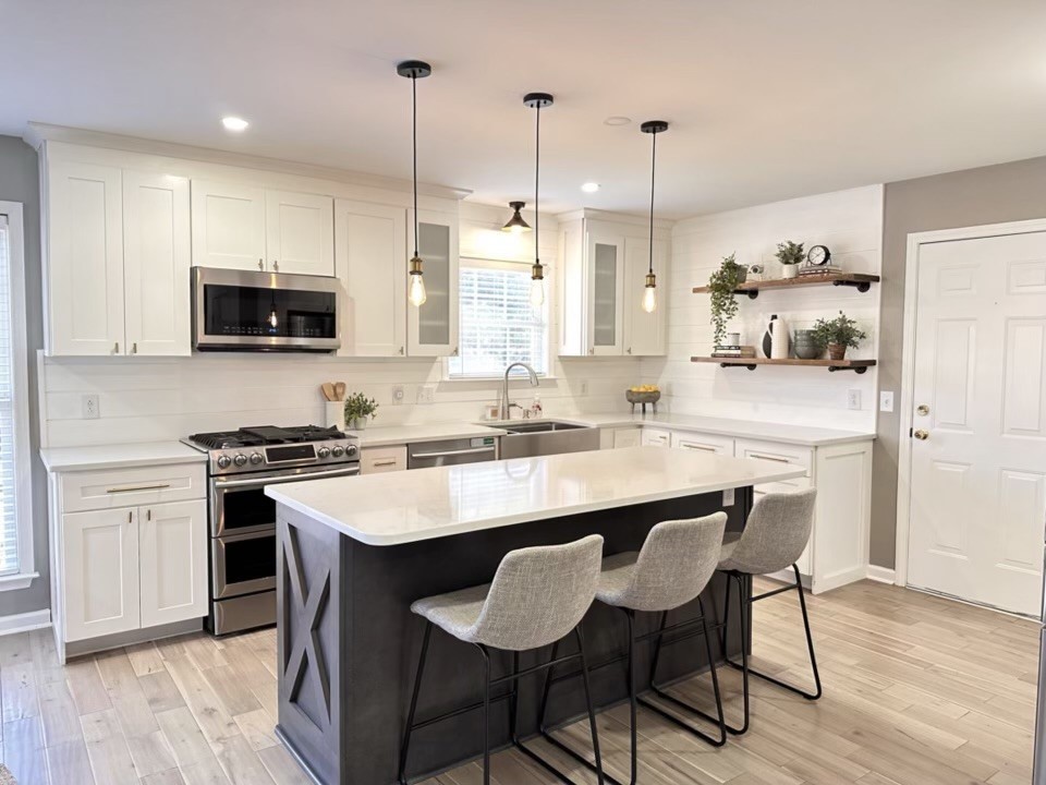 400 Roma Court Nashville, TN 37211 - Photo 10 of 31 a kitchen with stainless steel appliances granite countertop a stove a sink dishwasher a refrigerator and a dining table with wooden floor