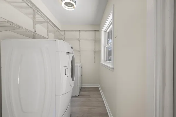 a bathroom with a granite countertop shower and a sink