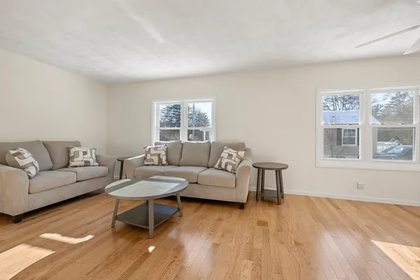 a living room with furniture and a window