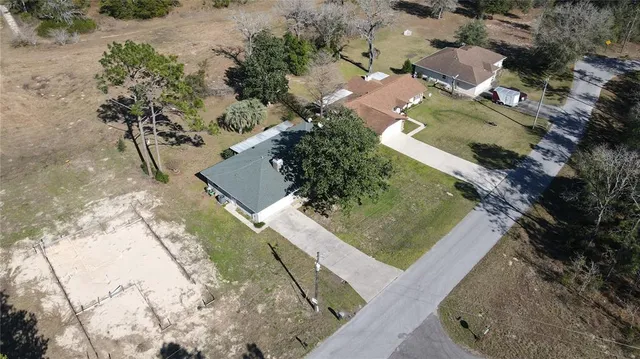 an aerial view of a house with a swimming pool