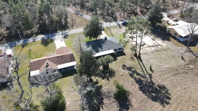 an aerial view of residential house with outdoor space