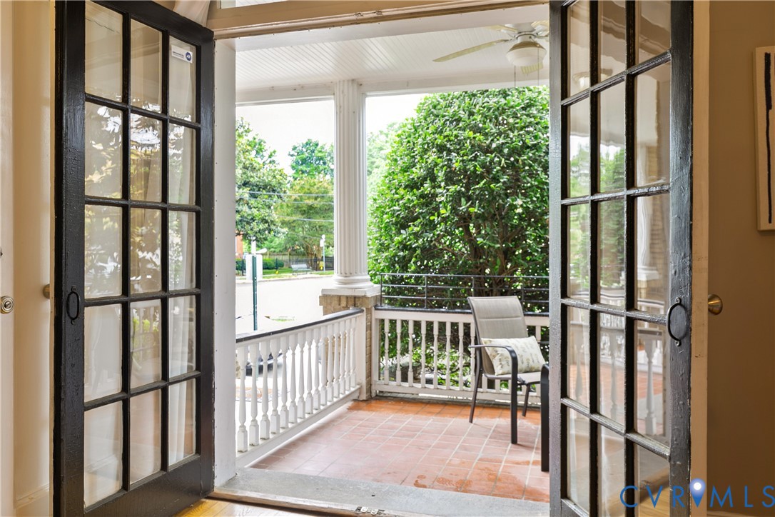 601 Roseneath Road, Unit U1 Richmond, VA 23221 - Photo 32 of 36 Porch with terra cotta tile flooring, white balust