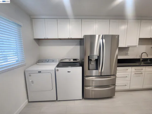 a kitchen with appliances and cabinets