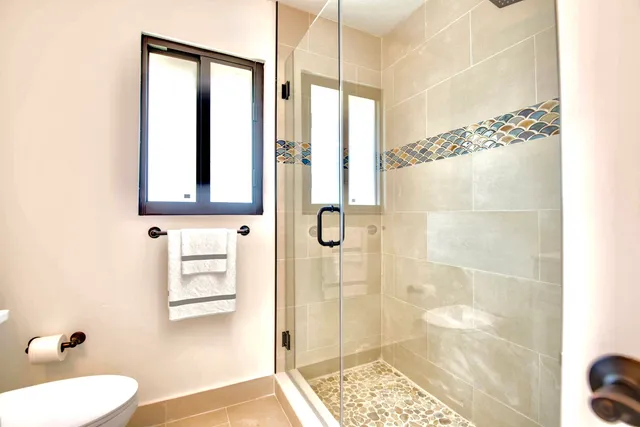 a view of a house with yard and sitting area