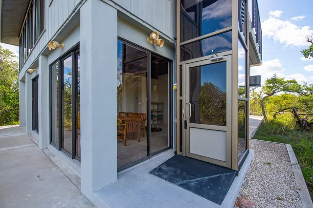 a view of a balcony with wooden floor