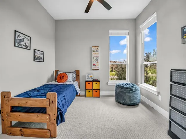 a bedroom with a bed and a couch