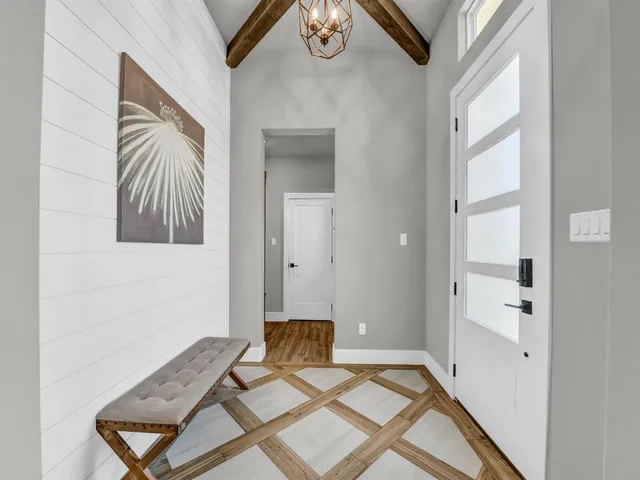 a view of a livingroom with furniture and windows