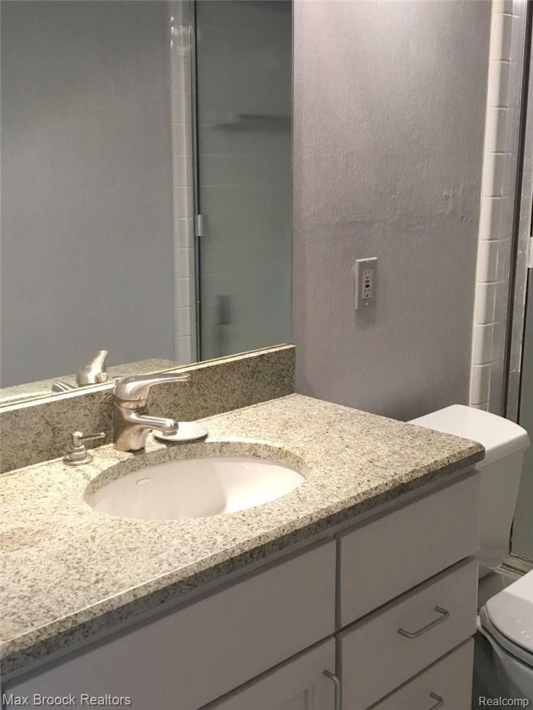 3404 Adams Road Troy, MI 48084 - Photo 20 of 27 BATH WITH SHOWER HAS AN UPGRADED GRANITE VANITY JUST OUT SIDE BEDROOM NUMBER 3.