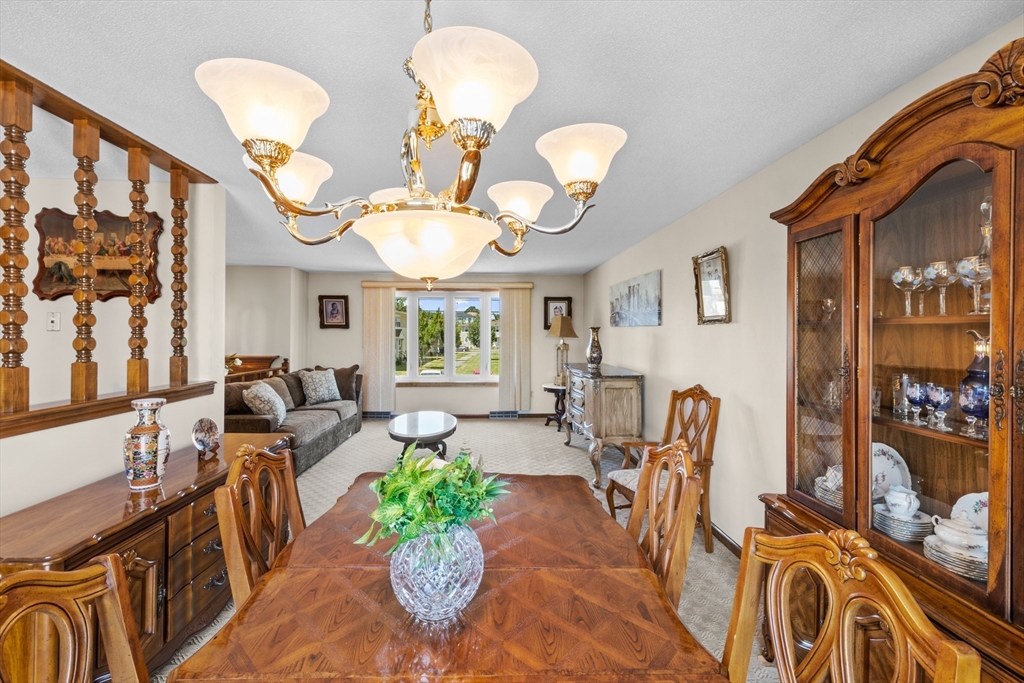 403 Aetna Street Fall River, MA 02721 - Photo 14 of 42 a view of a dining room and hall with furniture