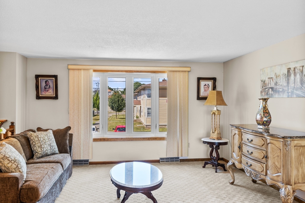 403 Aetna Street Fall River, MA 02721 - Photo 15 of 42 a living room with furniture and a window