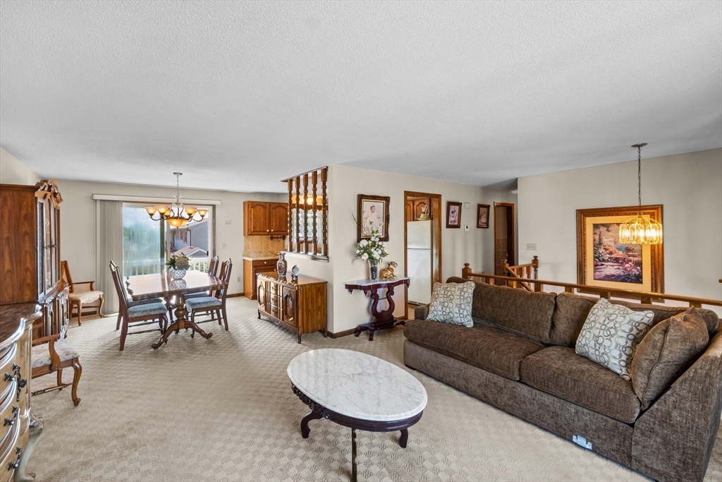 403 Aetna Street Fall River, MA 02721 - Photo 17 of 42 a living room with furniture and a large window